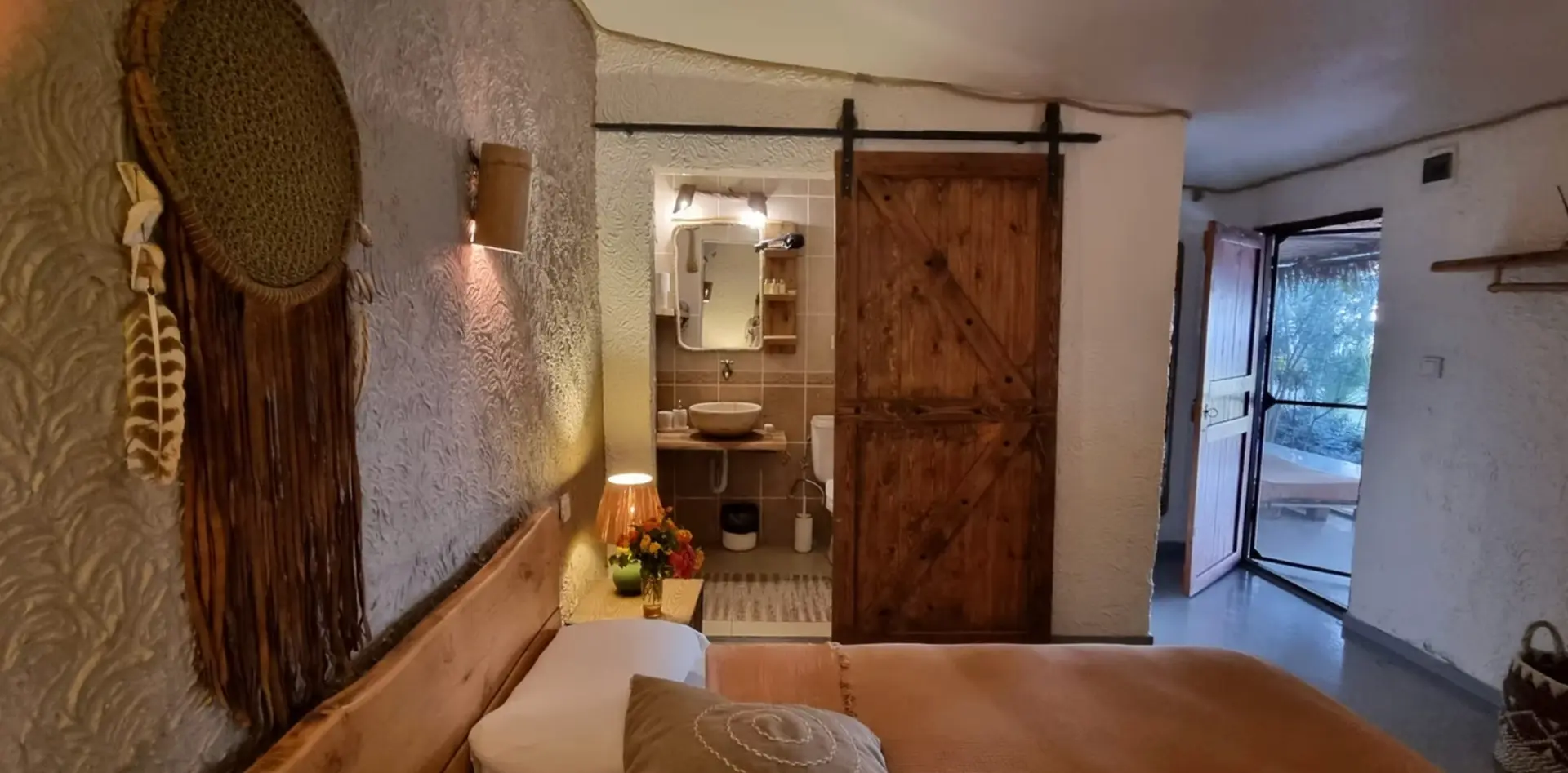 Sea front room interior looking through to the bathroom and terrace door